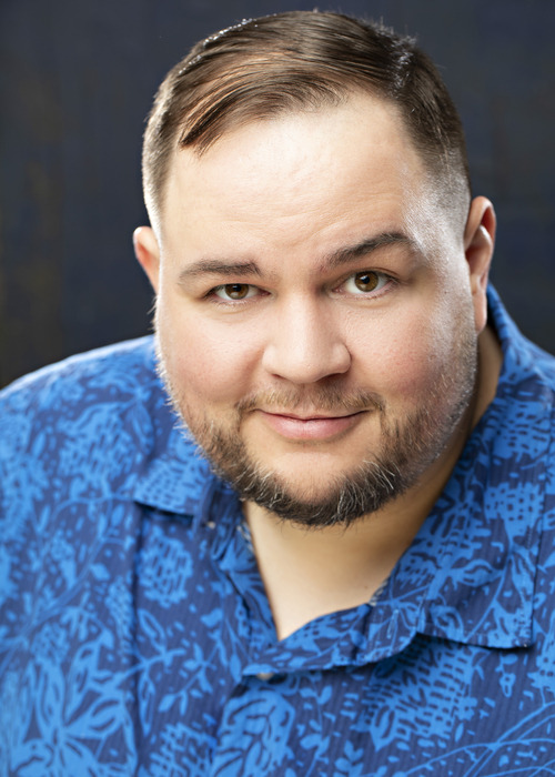 Head tilt, blue patterned shirt